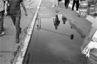 Callegrafia. Reflections in large puddle. Centro Historico, Mexico City.